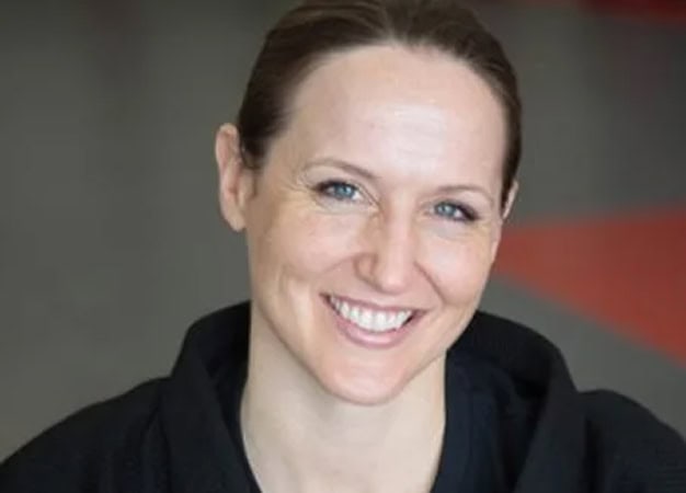 Women smiling during krav maga training at KRAV Zone martial arts gym in Bay Area.